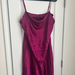 Magenta silk midi dress with slit on side and draped neckline.